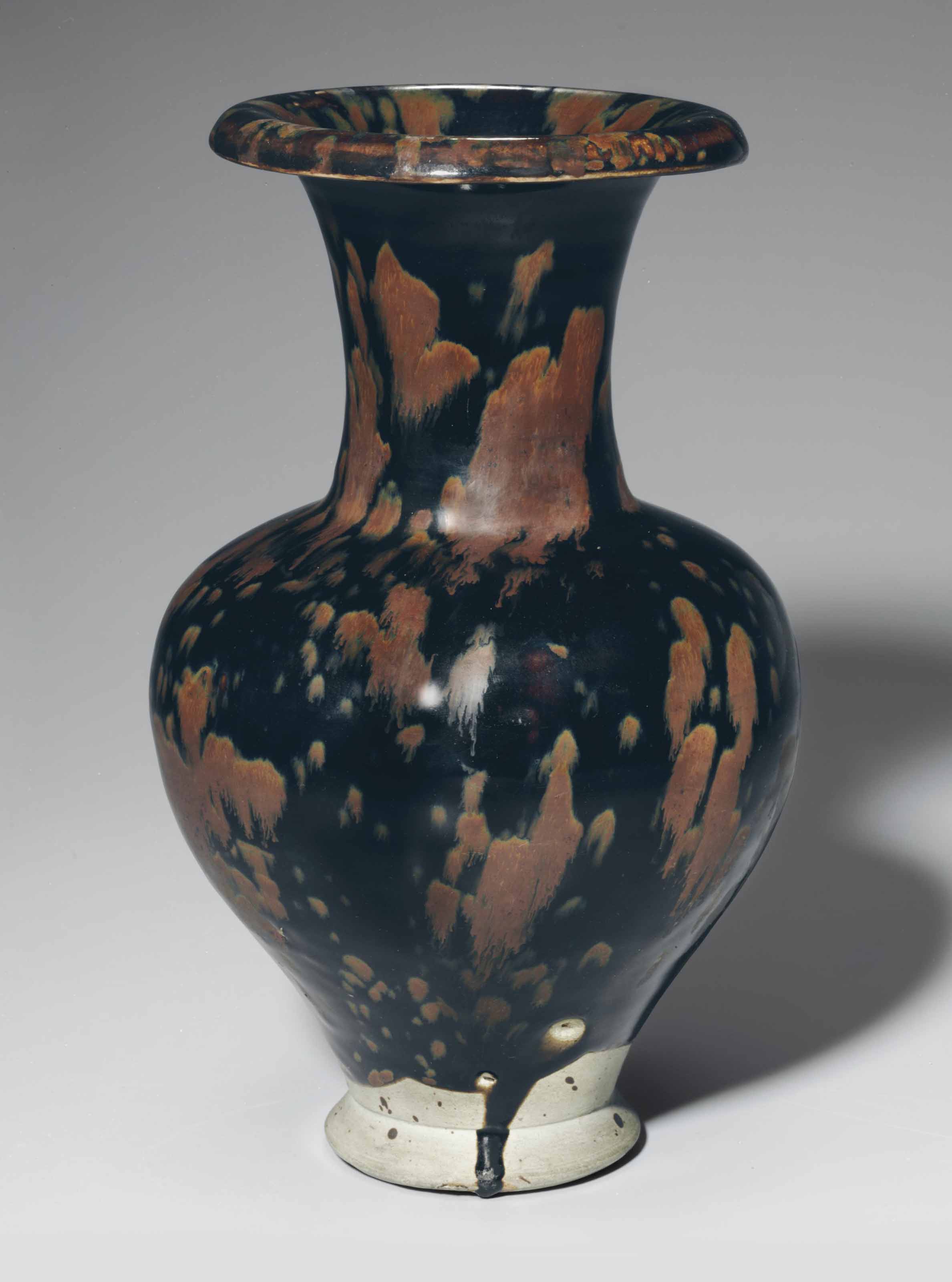 2016_NYR_12175_1306_000(a_very_rare_cizhou-type_black_and_russet_partridge_feather-glazed_vase