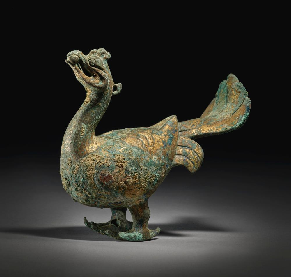 From the collection of Stephen Junkunc, III. An extremely rare gilt-bronze figure of a phoenix, Han dynasty (206 BC - 220 AD). Length 5 1/4  in., 13.4 cm. Estimate 80,000 — 120,000 USD. Lot Sold 162,500 USD at Sotheby's New York, 19th March 2019, lot 122. Courtesy Sotheby's.