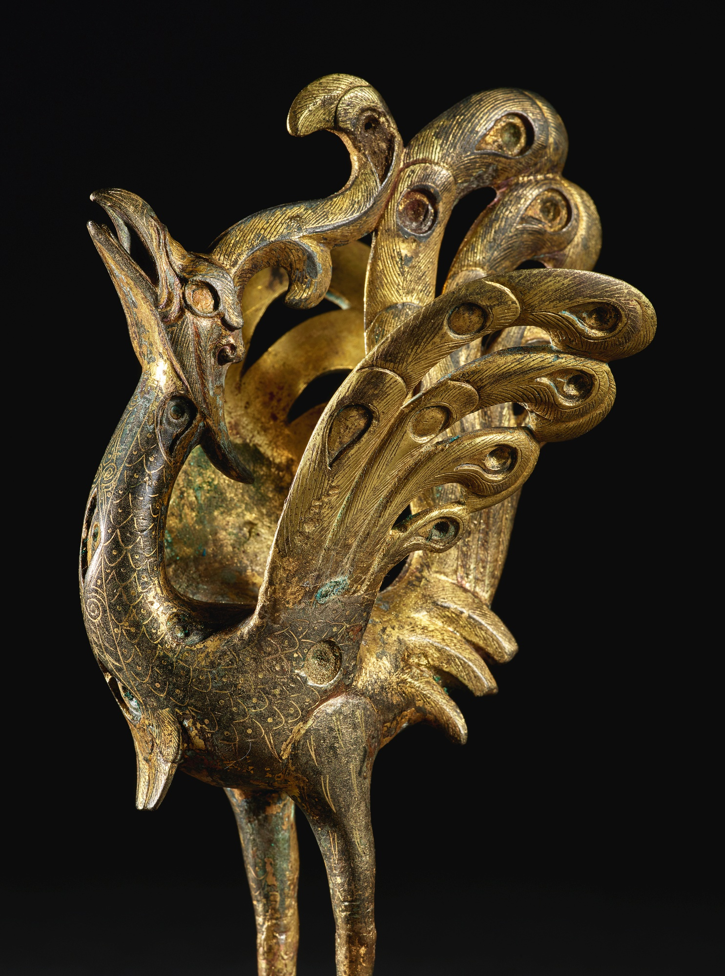 Lot 226. A splendid and rare gold and silver-inlaid parcel-gilt bronze figure of a peacock, Han dynasty (206 BC-AD 220). Height 6 1/8  in., 15.5 cm. Estimate 200,000 — 300,000 USD. Courtesy Sotheby's.