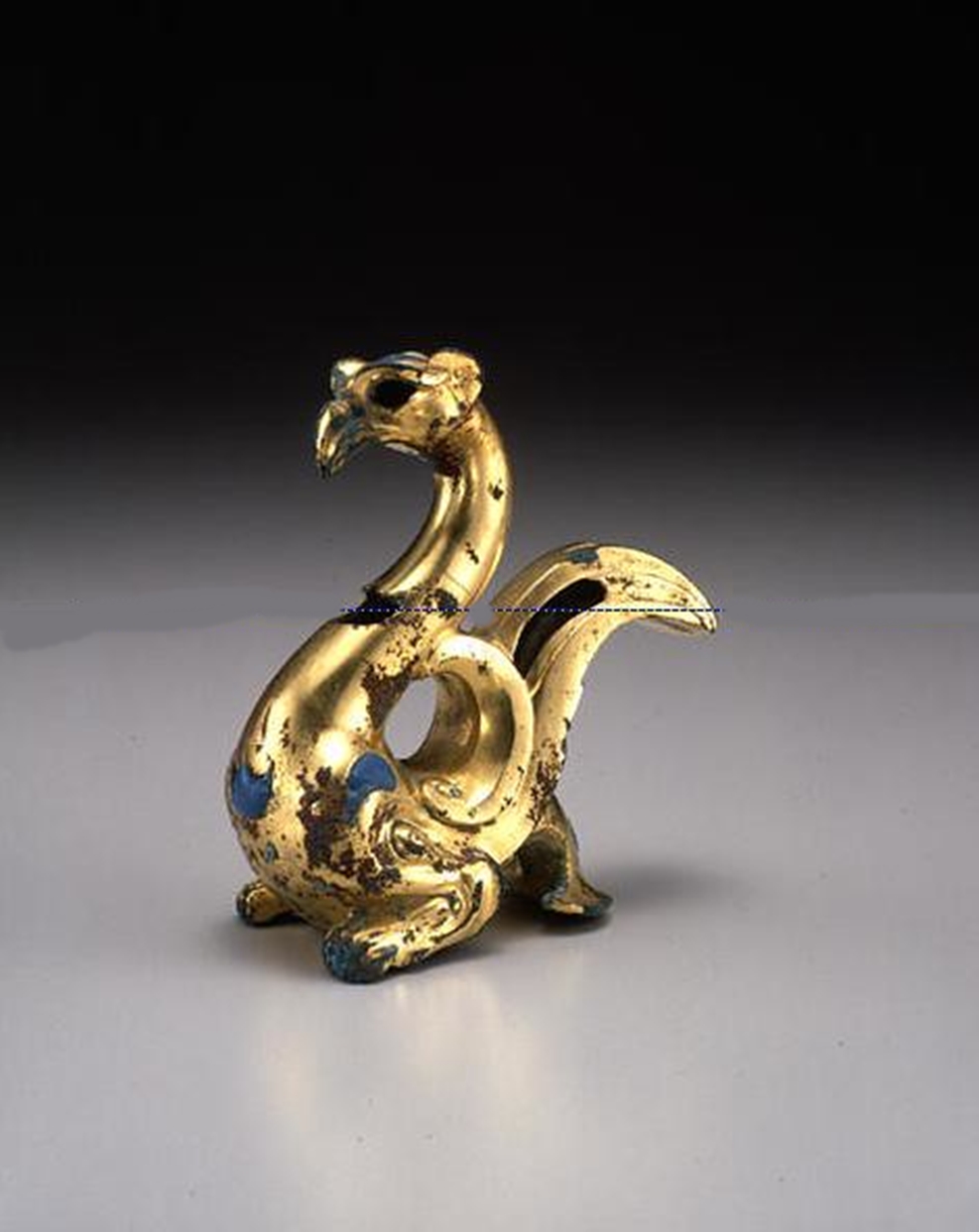 Western Han Chinese Gilded Bronze Ornament in the Form of a Mythical Animal with Glass Inlay