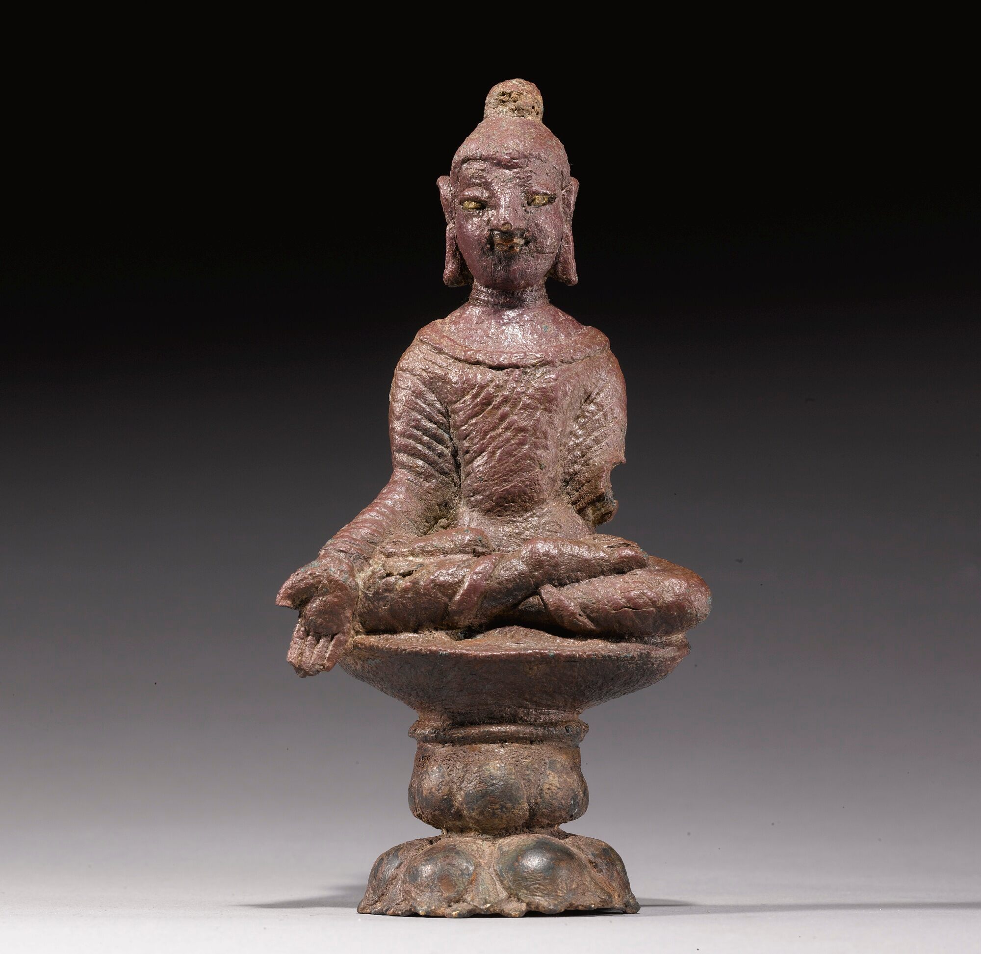 A COPPER ALLOY FIGURE OF SEATED BUDDHA Swat Valley, 6th/7th Century