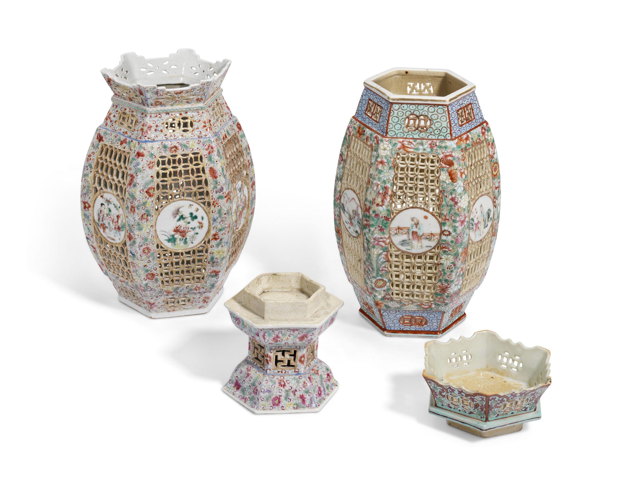 TWO FAMILLE ROSE RETICULATED LANTERNS AND STANDS