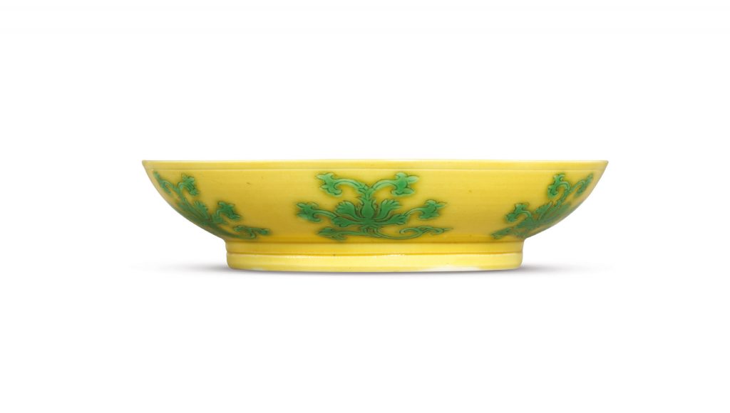 A FINE YELLOW-GROUND GREEN-ENAMELED 'LOTUS' SAUCER DISH 