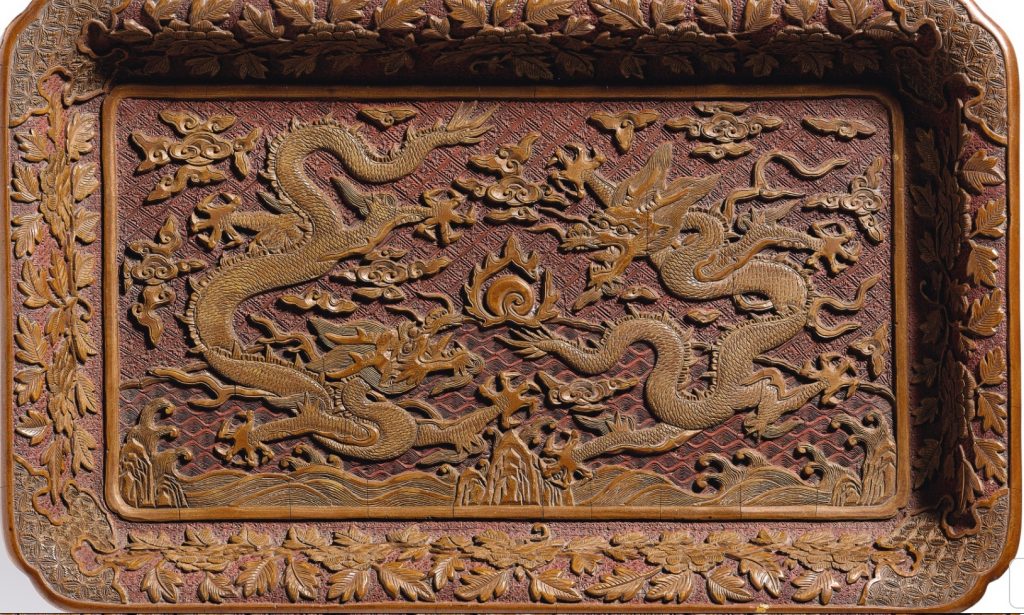 PROPERTY FROM THE KAISENDO MUSEUM A RARE CARVED YELLOW LACQUER 'DRAGON' TRAY MING DYNASTY, WANLI PERIOD, DATED TO THE RENCHEN YEAR (IN ACCORDANCE WITH 1592)