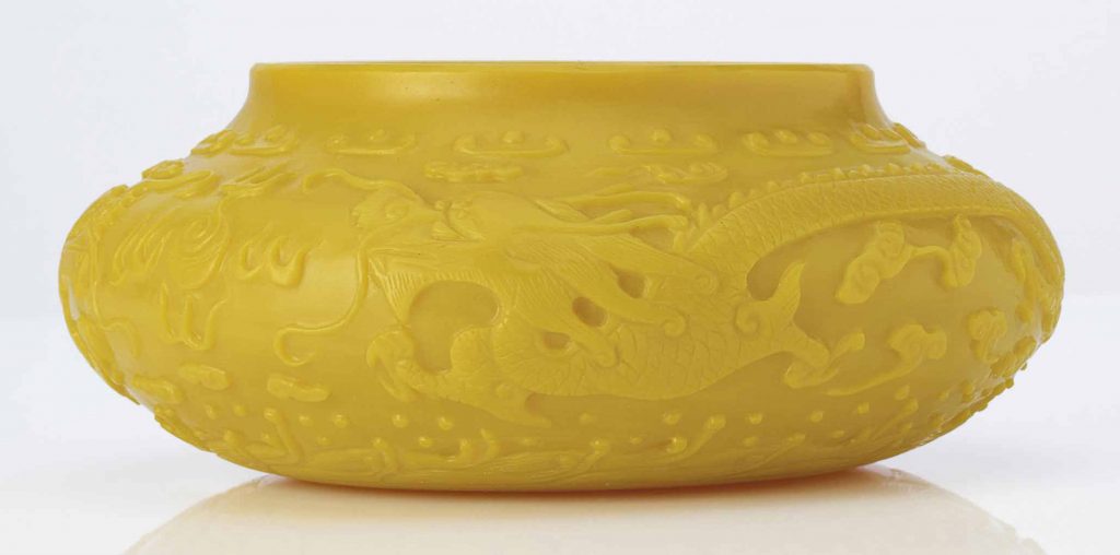 A CARVED OPAQUE IMPERIAL YELLOW GLASS BOWL 