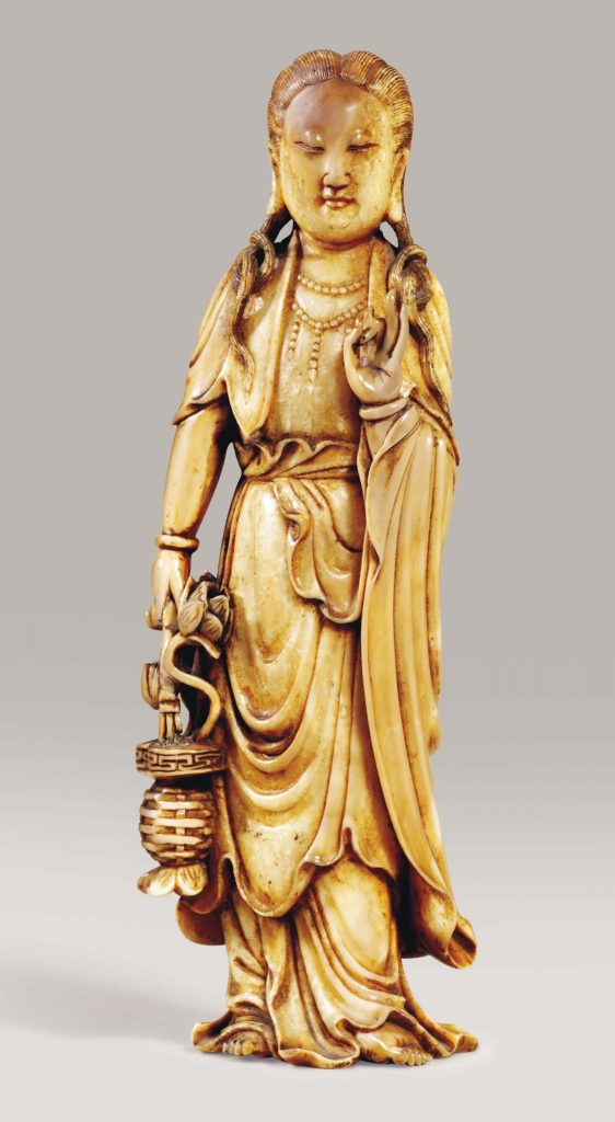 AN IVORY CARVING OF AN IMMORTAL 