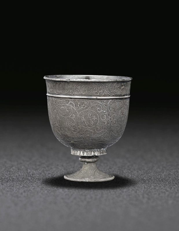 Lot 545. A small finely engraved silver stem cup